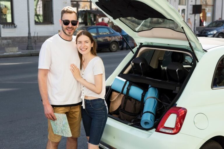 tourist-couple-getting-ready-leave-voyage-with-car_23-2148619941